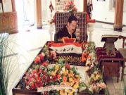 قيادي إيراني سابق يُهين قبر صدام حسين