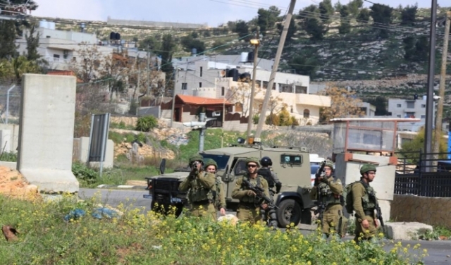 اعتقال 14 فلسطينيا بالضفة