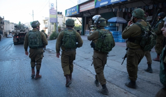 اعتقال 14 فلسطينيا بالضفة بينهم أسرى محررون