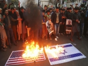 مصنع إيراني ينتج أعلام أميركا وإسرائيل لحرقها في المظاهرات