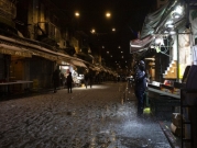 أحد أسواق القدس المحتلّة يكتسي بالثلج  