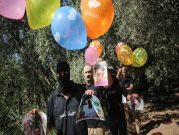 غزة: إطلاق "بالونات تحذيرية" تحمل رسائل وصور شهداء للاحتلال