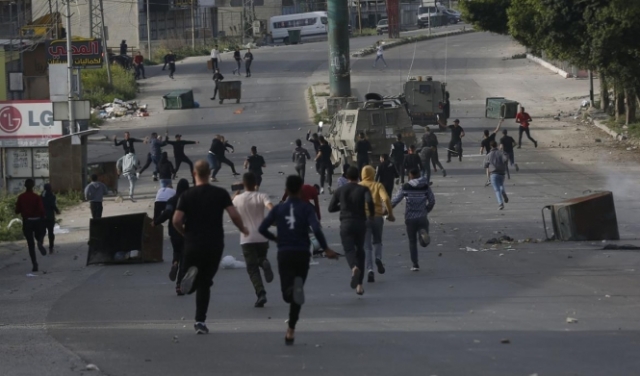 مواجهات واعتقالات طالت 26 فلسطينيا بالضفة